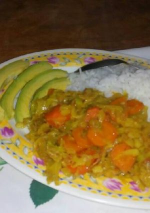 A picture of Boiled rice and cabbage served with avocado.