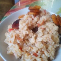 A picture of Jollof rice with dodo.
