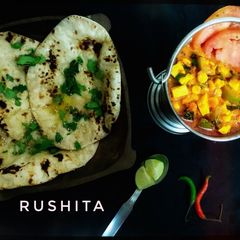 A picture of Paneer Corn Capsicum with Butter Naan.