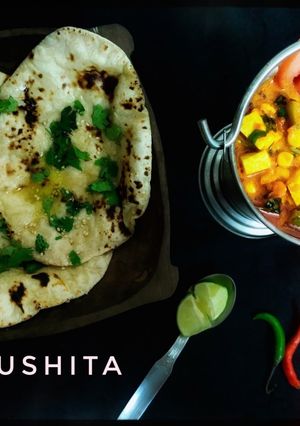 A picture of Paneer Corn Capsicum with Butter Naan.