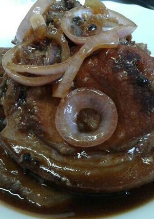 A picture of Marinated pork chops on soy sauce (Bistek).