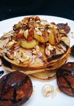 A picture of Banana pancakes and sweet appam.