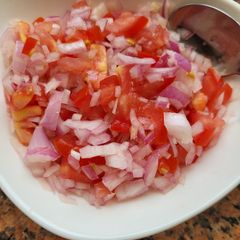 A picture of Onion Tomato Salad.