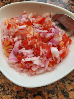 A picture of Onion Tomato Salad.