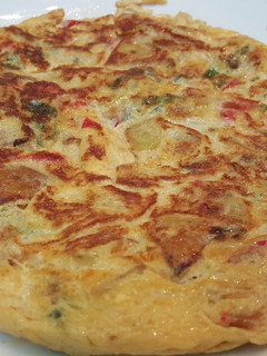 Una foto de Tortilla de pimientos y cebolla
