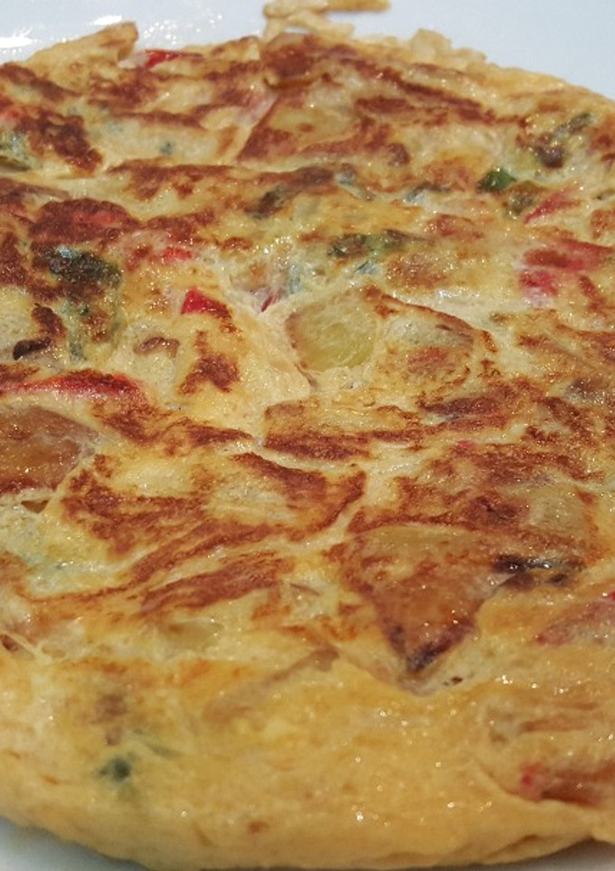 Una foto de Tortilla de pimientos y cebolla