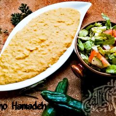 A picture of Yellow Mujadara ; Red lentils with rice.