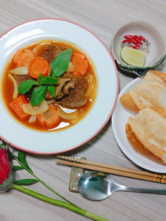A picture of Beef Stew with Baguette.