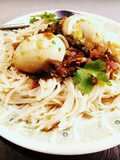 Boiled spaghetti and egg curry