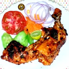 The Grilled And Charcoaled Chicken A picture of The Grilled And Charcoaled Chicken.