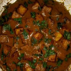 A picture of Paneer in tomato gravy.