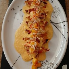A picture of Shahi tukda with mango rabdi.