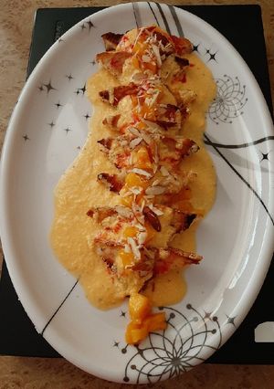 A picture of Shahi tukda with mango rabdi.