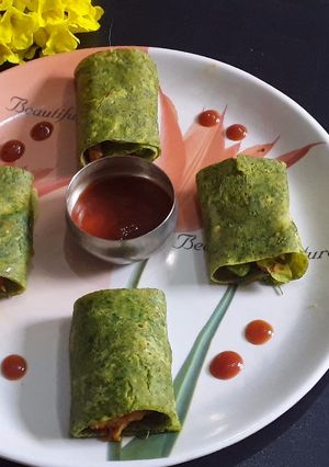 A picture of Coriander chilla roll up.