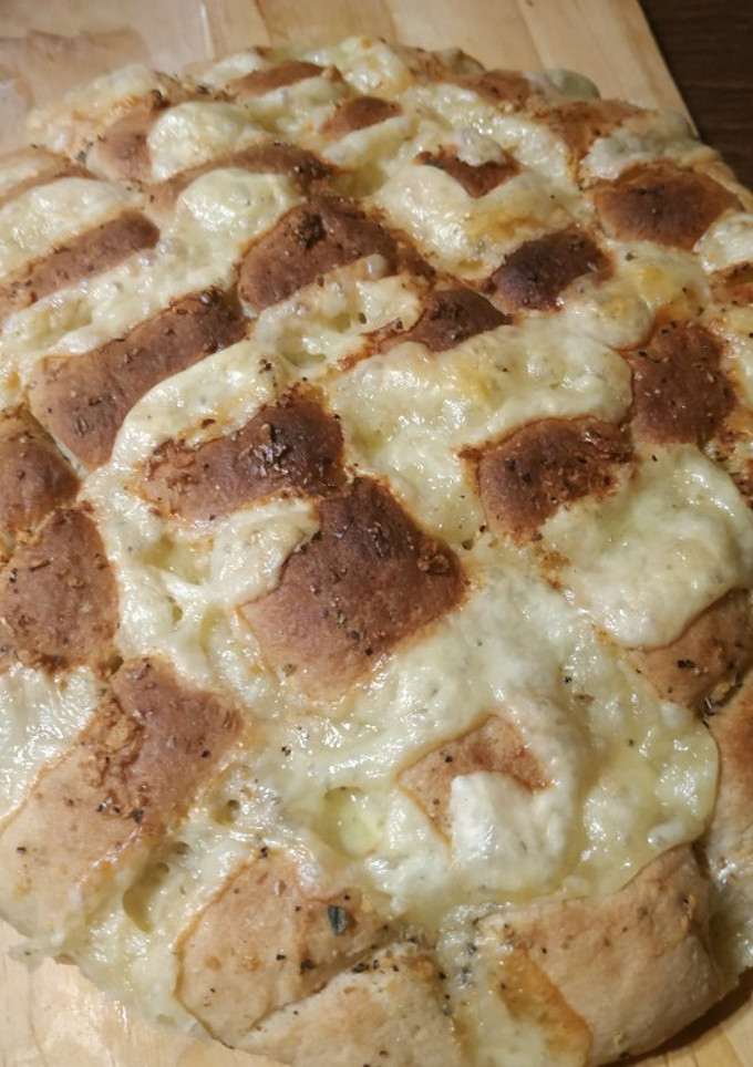 Una foto de Pan de ajo relleno con queso