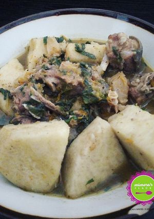 A picture of Goat meat, stock fish and yam pepper soup.