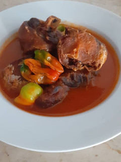 A picture of Fried fish and chicken soup.