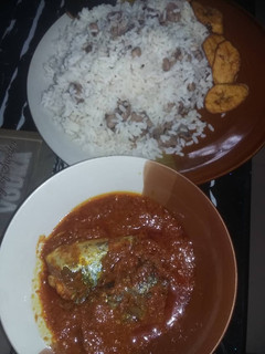 A picture of Titus fish stew with boiled rice and beans.