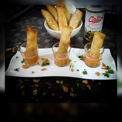 A picture of CHEESY CIGAR with PINEAPPLE SAUCE.