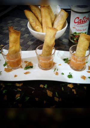 A picture of CHEESY CIGAR with PINEAPPLE SAUCE.