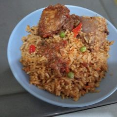 Jollof Rice with veggies and chicken A picture of Jollof Rice with veggies and chicken.