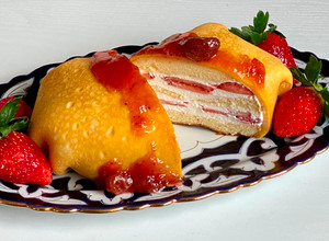 A picture of Omu Cake (Strawberry and whipped cream cake wrapped in egg-fry).