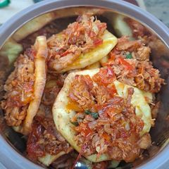A picture of Sweet potato with chicken dressing.