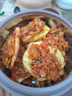 A picture of Sweet potato with chicken dressing.