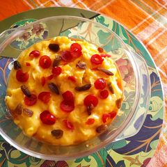 A picture of Caramel custard with dry fruits.