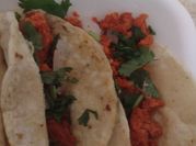 Una foto de longaniza en salsa verde