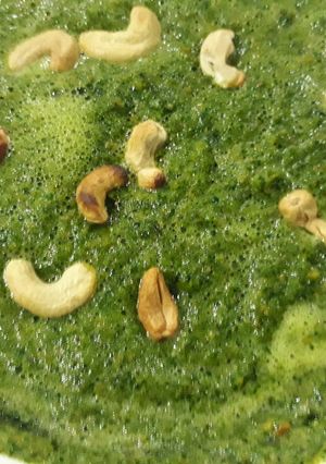 A picture of Vegetable with cashew toppings.