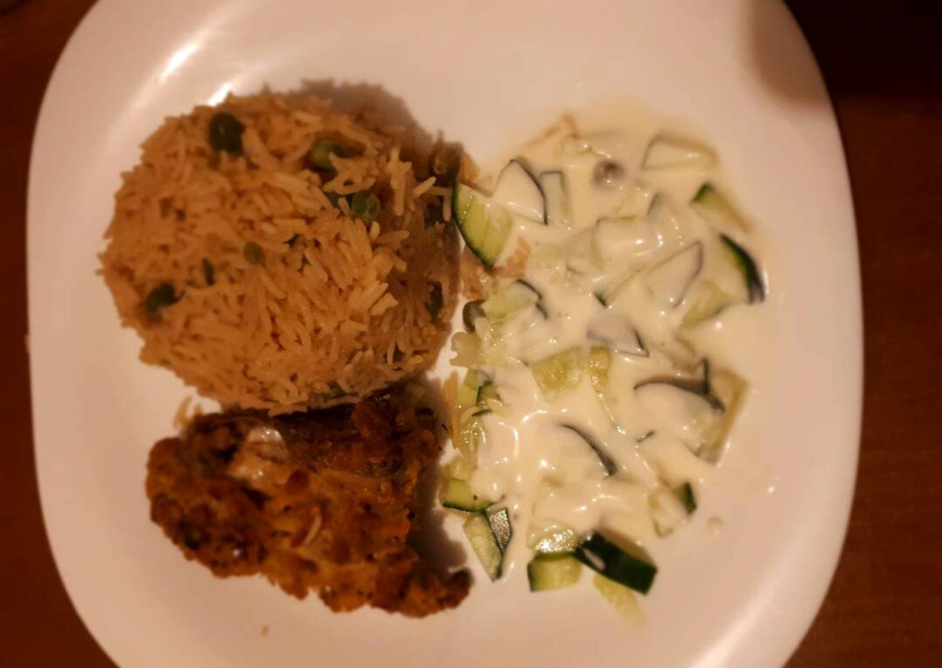 Rice served with coated chicken and sauce