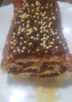 Una foto de Arrollado con dulce de leche y chispitas de chocolate