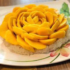 A picture of White rice with Mangos.