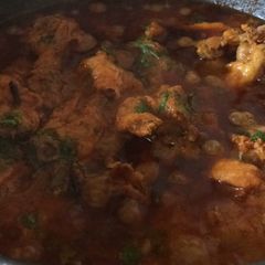 Chicken in brown oinon paste gravy A picture of Chicken in brown oinon paste gravy.
