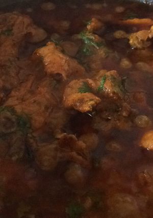 A picture of Chicken in brown oinon paste gravy.