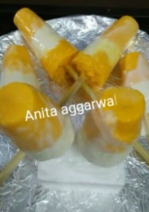 A picture of Indian frozen dessert mango bar(popsicle) with curd.