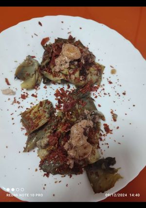 Una foto de Corazones de alcachofa con virutas de jamón y foie