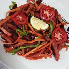 A picture of Shallow fried sausage strips.