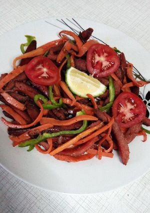 A picture of Shallow fried sausage strips.
