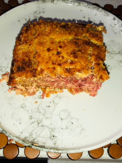 Una foto de Budín de arroz rojo y queso