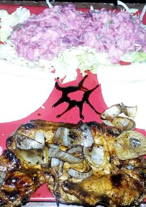 Una foto de Bisteck encebollado