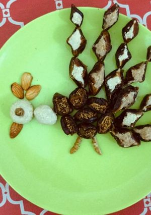 A picture of Dryfruits sweet in Peacock pattern.