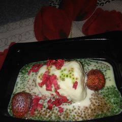 A picture of Lychee kulfi in muti-coloured chia seeds pond.