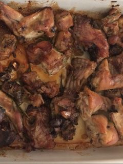 Una foto de Conejo al horno con toque de romero