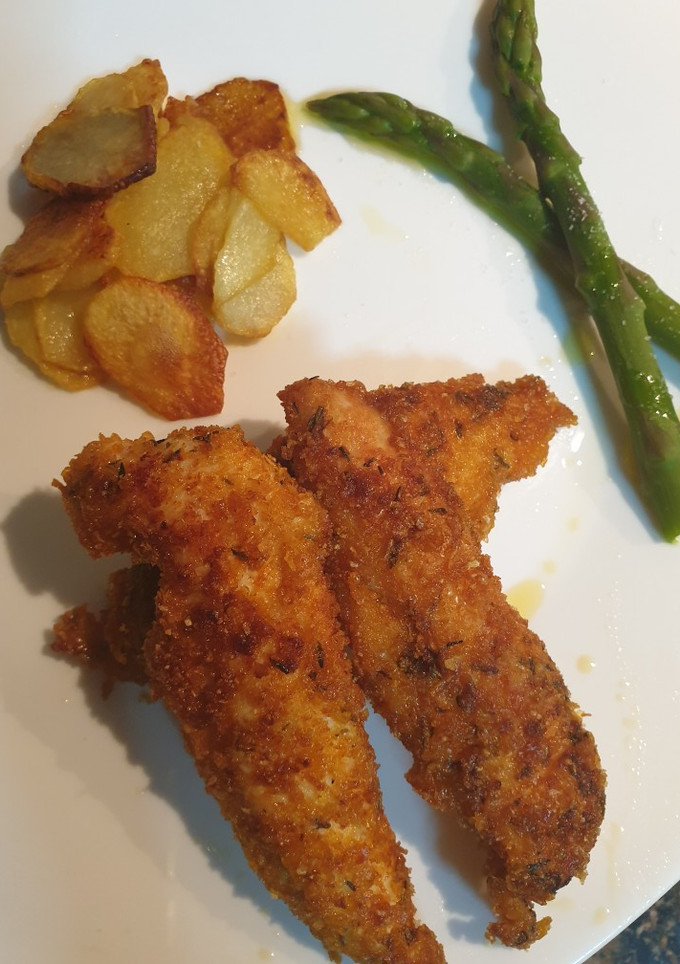 Una foto de Fingers de pollo crunchy crumbs con especias
