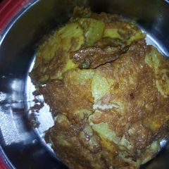 A picture of Fried potatoes with egg.