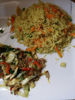 A picture of Fried rice with mackerel vegetable sauce.