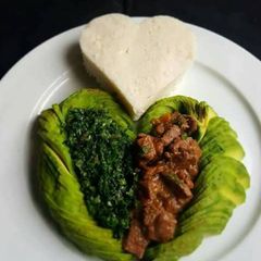 A picture of Beef wet fry with Ugali.