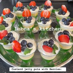 A picture of Custard jelly pots with Berries:.